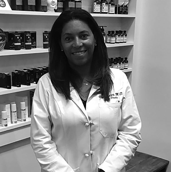 Dr. Kates at pharmacy in black and white